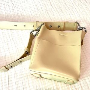 AllSaints genuine leather cream colored bucket bag